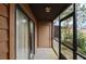 Cozy screened porch with tiled floor and storage closet at 707 Carpenters Way # 45, Lakeland, FL 33809