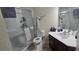 Bathroom with shower, toilet, and vanity with dark wood cabinets at 8252 Civita Dr # 201, Davenport, FL 33896