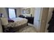 Bedroom with floral bedding, dark wood furniture, and two windows at 8252 Civita Dr # 201, Davenport, FL 33896