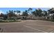 Community clubhouse with fountain, paver driveway, and landscaping at 8252 Civita Dr # 201, Davenport, FL 33896