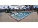 Large community pool with lounge chairs and surrounding landscaping at 8252 Civita Dr # 201, Davenport, FL 33896