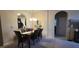 Dining area with table, chairs, and a view into the kitchen at 8252 Civita Dr # 201, Davenport, FL 33896