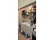Laundry room with stacked washer and dryer, and storage shelves at 8252 Civita Dr # 201, Davenport, FL 33896