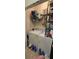 Laundry room with stacked washer and dryer, and storage shelves at 8252 Civita Dr # 201, Davenport, FL 33896
