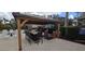 Outdoor kitchen and grilling area with bar seating and a covered pergola at 8252 Civita Dr # 201, Davenport, FL 33896