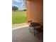 Small patio area with table and chairs, overlooking grassy area at 902 Assembly Ct, Reunion, FL 34747