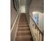 Interior staircase leading to upper level at 902 Assembly Ct, Reunion, FL 34747