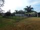 Fenced backyard with pool, patio area, and lush green lawn at 915 Ekana Green Ct, Oviedo, FL 32765