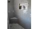 Modern shower with gray tile, built-in shelves, and a bench at 915 Ekana Green Ct, Oviedo, FL 32765
