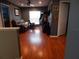 Bonus room with wood floors, leather couch, and arcade game at 915 Ekana Green Ct, Oviedo, FL 32765