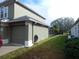 View of the home's exterior, garage, driveway, and side yard at 915 Ekana Green Ct, Oviedo, FL 32765