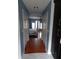 Hallway leading to the main bedroom with wood floors and arched doorways at 915 Ekana Green Ct, Oviedo, FL 32765