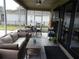 Comfortable patio area with furniture, dining set, and built-in entertainment area at 915 Ekana Green Ct, Oviedo, FL 32765