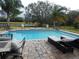 Inviting pool and patio area with a view of the golf course at 915 Ekana Green Ct, Oviedo, FL 32765