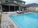 Spacious pool and patio with screened lanai and outdoor furniture at 915 Ekana Green Ct, Oviedo, FL 32765