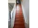 Wooden staircase with white railing and hardwood treads at 915 Ekana Green Ct, Oviedo, FL 32765