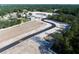 Aerial view of a curved street with empty plots next to existing homes at 987 Hawksnest Pt, Oviedo, FL 32765