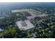 Aerial view of neighborhood with winding streets, construction sites, and existing homes at 987 Hawksnest Pt, Oviedo, FL 32765