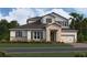 Exterior rendering of a two-story home with a stone and siding facade, and attached garage at 987 Hawksnest Pt, Oviedo, FL 32765
