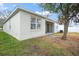 Backyard view of a house with a covered patio at 10421 Andover Point Cir, Orlando, FL 32825