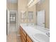 Dual vanity bathroom with a shower and tub combination at 10421 Andover Point Cir, Orlando, FL 32825