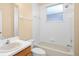 Bathroom featuring a bathtub, toilet, and single vanity sink with a tiled backsplash at 10421 Andover Point Cir, Orlando, FL 32825