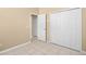 Bedroom with closet, neutral walls, and tile flooring at 10421 Andover Point Cir, Orlando, FL 32825