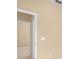 Hallway with neutral-toned walls and tiled flooring leading to other rooms at 10421 Andover Point Cir, Orlando, FL 32825