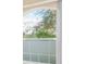 Large arched window with frosted glass panes providing privacy and natural light at 10421 Andover Point Cir, Orlando, FL 32825