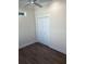 Bedroom with wood-look flooring and a double-door closet at 12143 Grand Oak Ln, Oxford, FL 34484