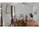 Dining room featuring a glass-top table, wood-look flooring, and decorative wall accents at 1363 Whitewood Dr, Deltona, FL 32725