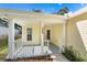 Front porch with white railing and entry door at 2436 Princeton Ave, Sanford, FL 32771