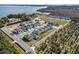 A high angle shot of a housing development near a lake and agricultural fields at 3007 Tackle Dr, Leesburg, FL 34748