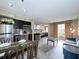 Open living area with kitchen, dining, and living space at 3100 Parkway Blvd # 110, Kissimmee, FL 34747