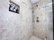 Walk-in shower with tiled walls, dual shower heads, and recessed shelving at 3100 Parkway Blvd # 110, Kissimmee, FL 34747