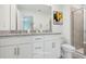 Modern bathroom with double vanities, a walk-in shower, and white cabinets at 3314 Thicket St, Tavares, FL 32778