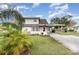 Charming single story home with gray exterior, landscaped yard, and covered carport at 3429 Palm Rd, Lakeland, FL 33810