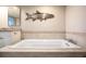 Luxurious main bathroom featuring a large soaking tub at 5255 S Atlantic Ave # 1101, New Smyrna Beach, FL 32169