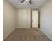 Empty bedroom with neutral walls, carpeting, and two doors at 6414 Flat Lemon Dr, Winter Garden, FL 34787