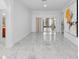 Dining area with light gray tile flooring and sliding glass doors at 686 Cotulla Dr, Kissimmee, FL 34758