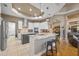 Modern kitchen with white and gray cabinets, an island, and stainless steel appliances at 715 Sanctuary Dr, Oviedo, FL 32766