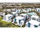 Aerial view of a townhome community with pool and parking at 7770 Sandy Ridge Dr # 114, Reunion, FL 34747