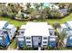 Aerial view of townhome with rooftop deck and proximity to resort amenities at 7770 Sandy Ridge Dr # 114, Reunion, FL 34747