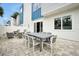 Paved patio with outdoor dining set and comfortable seating area at 7770 Sandy Ridge Dr # 114, Reunion, FL 34747