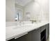 Modern bathroom with double sinks, white countertop, and large mirror at 7770 Sandy Ridge Dr # 114, Reunion, FL 34747
