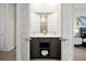 View of a modern bathroom with a double vanity and contemporary fixtures through open doors at 7770 Sandy Ridge Dr # 114, Reunion, FL 34747