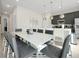 Dining area with marble table, modern gray chairs, and adjacent to the kitchen at 7770 Sandy Ridge Dr # 114, Reunion, FL 34747