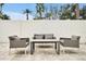 Relaxing patio area with comfortable outdoor seating and a small table at 7770 Sandy Ridge Dr # 114, Reunion, FL 34747