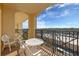 Private balcony with table and chairs, offering scenic views at 8112 Poinciana Blvd # 1709, Orlando, FL 32821
