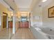Bathroom with a jacuzzi tub, double vanity, and a separate shower at 8112 Poinciana Blvd # 1709, Orlando, FL 32821